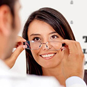 Young woman getting fitted for glasses